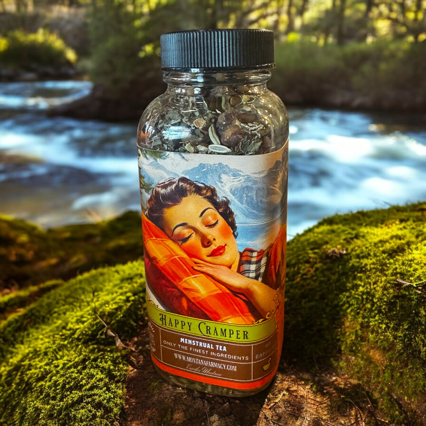 Bottle of 'Happy Camper' tea with a scenic background
