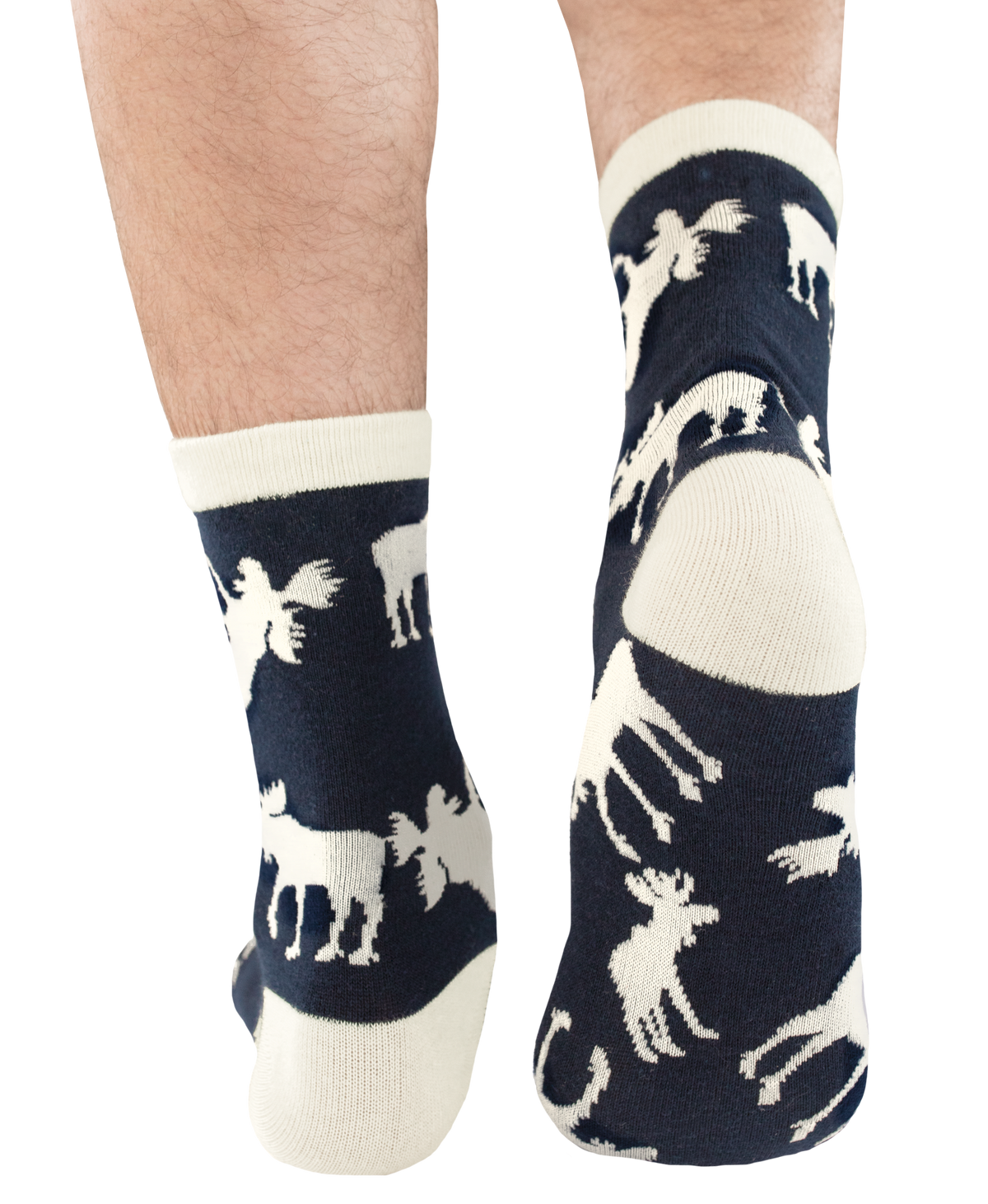 A pair of crew socks worn on a person's feet, featuring a dark navy blue background with white knit silhouettes of moose. The socks have cream-colored cuffs, heels, and toes.