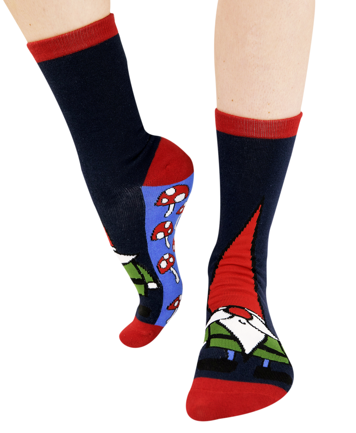 A pair of crew socks worn on feet, featuring a dark navy blue base with red cuffs and toes, a blue heel panel with red-and-white mushrooms, and a gnome face graphic on the front sock.