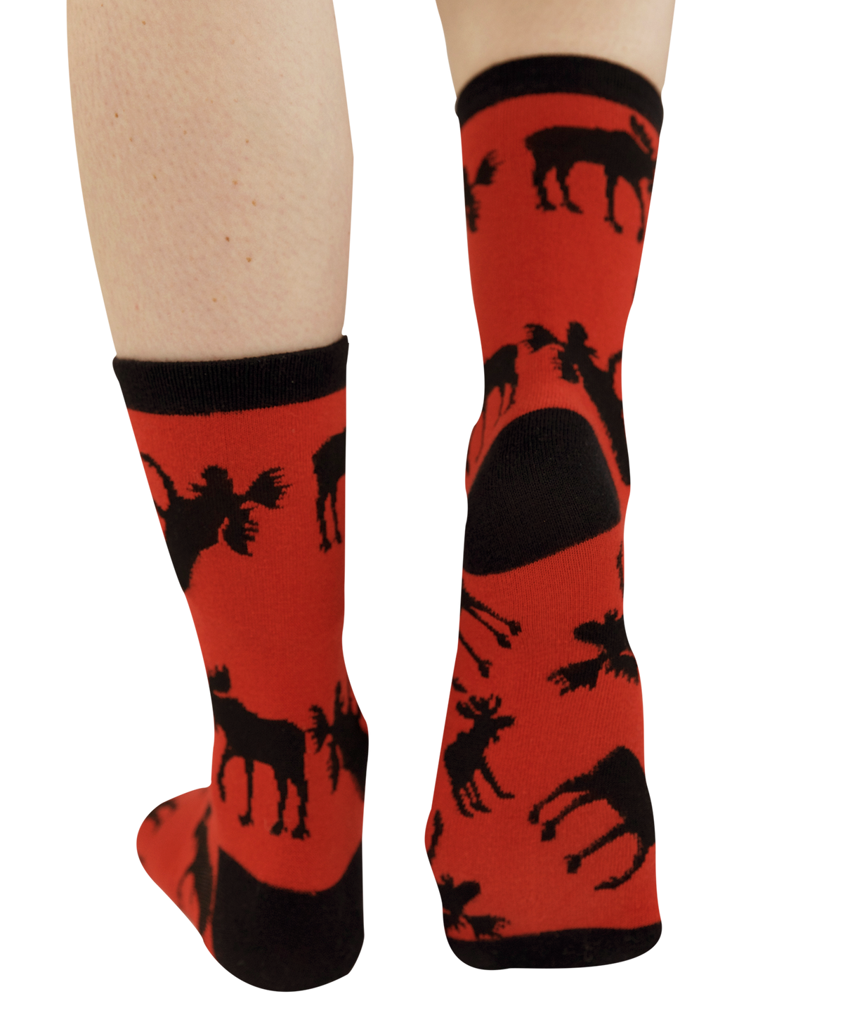 A pair of red crew socks with black knit cuffs, heels, and soles, featuring a black silhouette pattern of moose, shown on a person's legs against a white background.