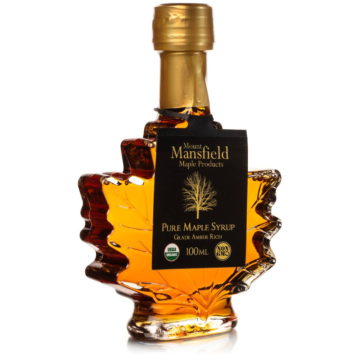 Bottle of Mount Mansfield Maple Products pure maple syrup with a gold cap on a white background