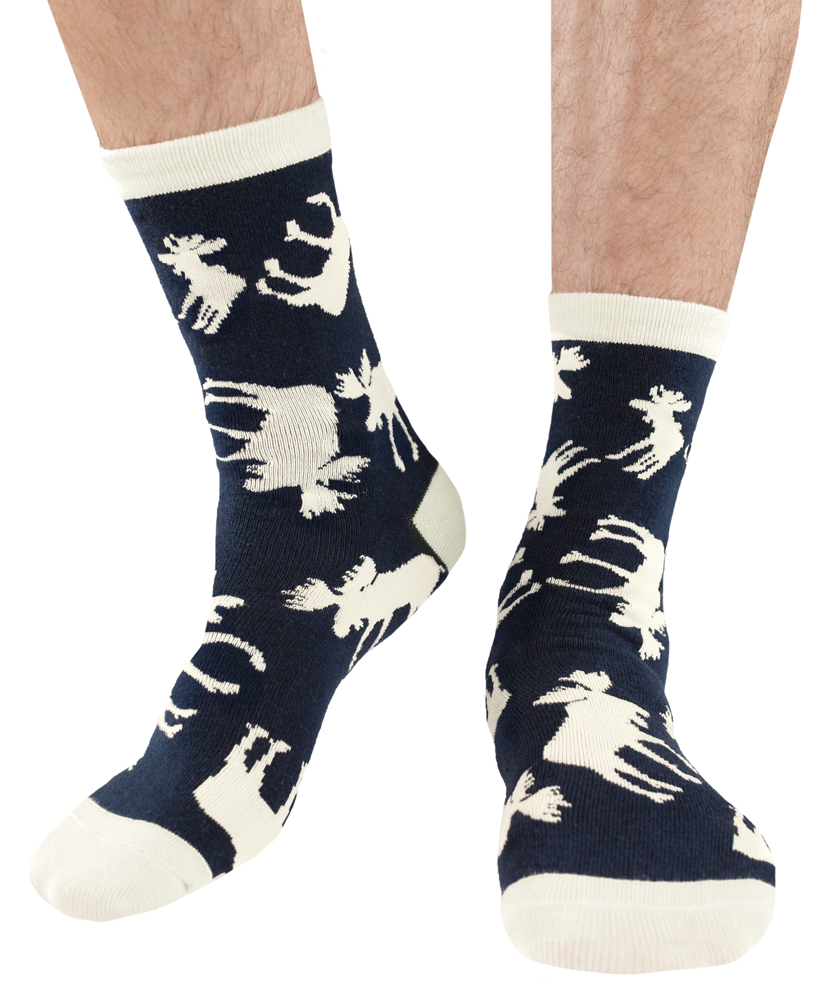 A pair of crew socks worn on a person's feet, featuring a dark navy blue background with a cream-colored allover pattern of moose silhouettes and solid cream toe, heel, and cuff sections.