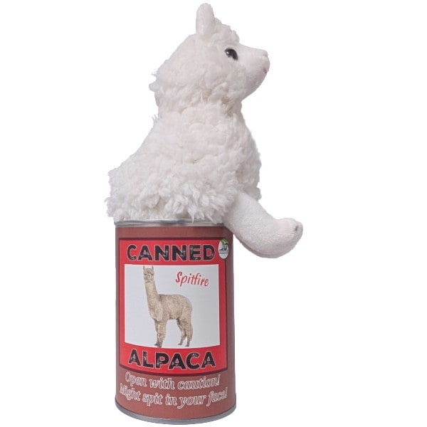 Plush toy resembling an alpaca on a can labeled 'Canned Alpaca' with a red label on a white background