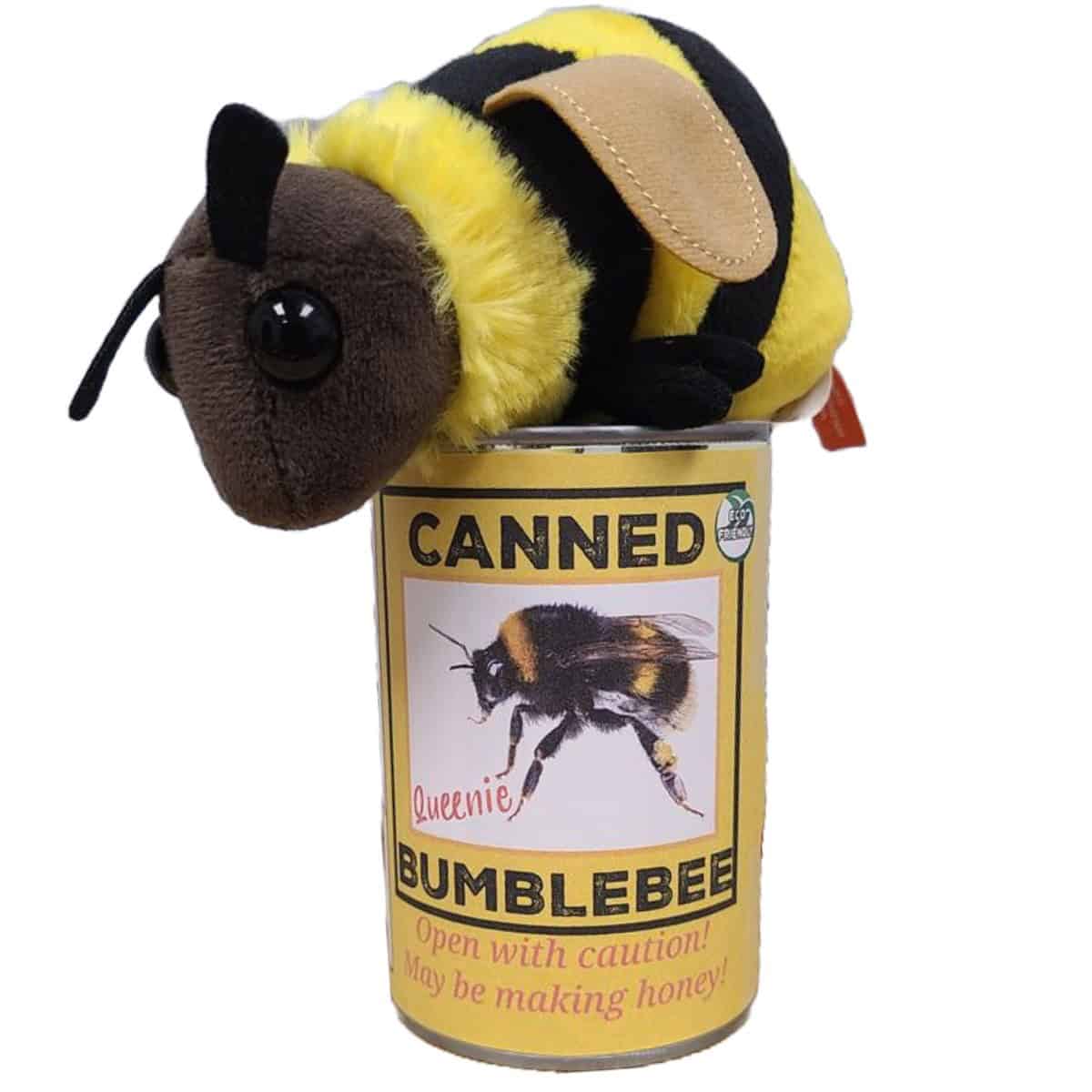 Plush toy bee on top of a can labeled 'Canned Bumblebee' on a white background