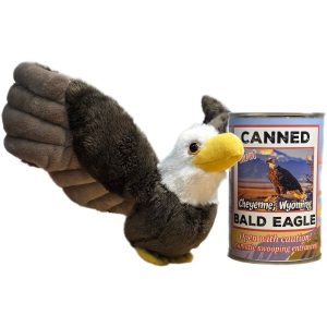 Plush eagle toy next to a can Labeled 'Canned Bald Eagle"  on a white background