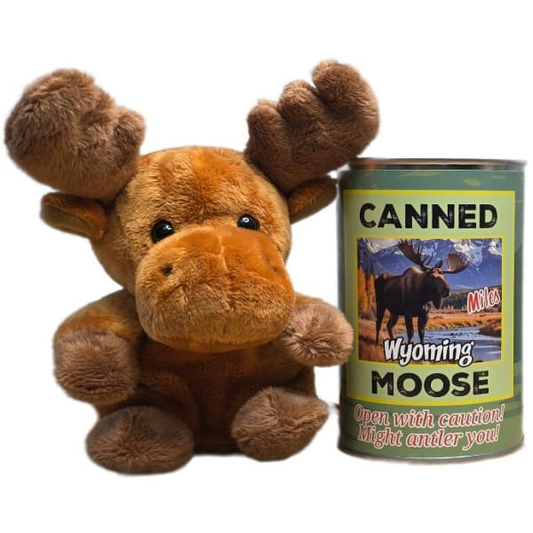 Miles the Canned Wyoming Moose stuffed plush toy beside a silver pop-top can with jokes — Wyoming themed gift